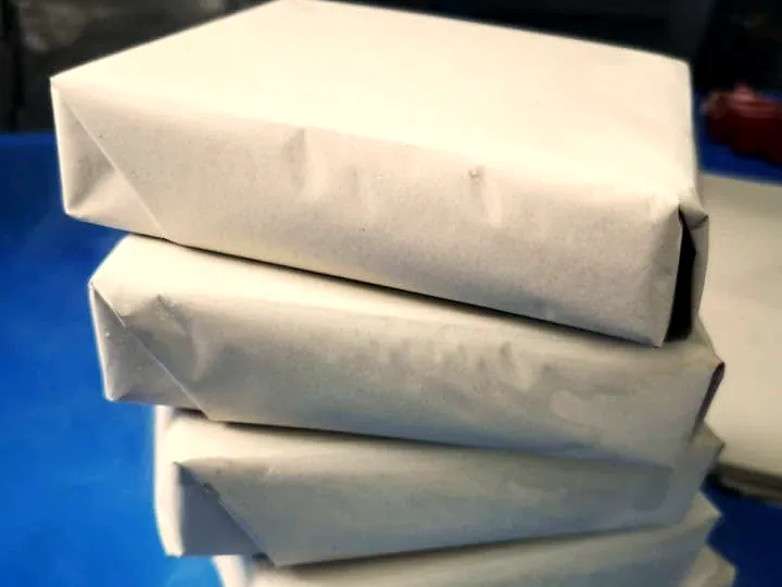 Paper-wrapped dry ice blocks stacked up